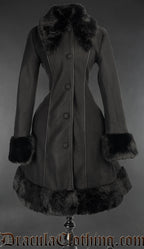 Women's black coat with faux fur accents front button closure and piping down the front