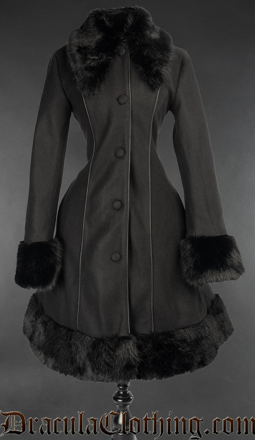 Women's black coat with faux fur accents front button closure and piping down the front