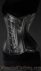 Side view of black faux leather corset showing extreme waist shaping