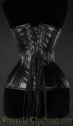 Back view of black faux leather extreme waist corset showing matching modesty panel and adjustable lacing