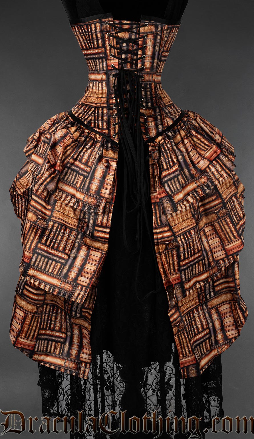 Back view of printed book themed corset with layered bustle attachment showing adjustable lacing and modesty panel in matching print fabric