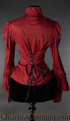 Back view of women's red satin brocade blouse showing adjustable torso lacing