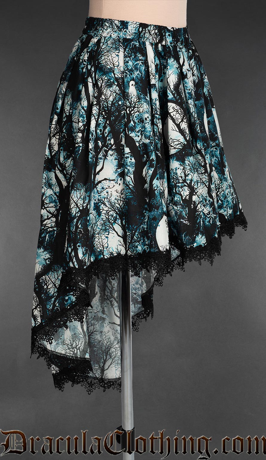 Side view of women's blue print high low skirt with moonlit forest design showing skirt length longer in the back than the front