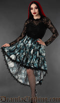 Women's high low skirt with black lace trim featuring blue print of a moonlit forest