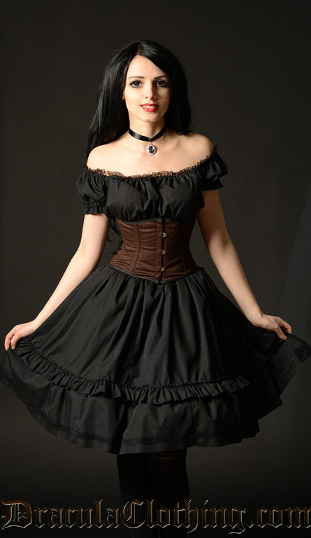 Black knee length women's dress with lace trim detail in the bust worn with the sleeves off shoulder