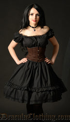 Black knee length women's dress shown on a model in an off shoulder styling 