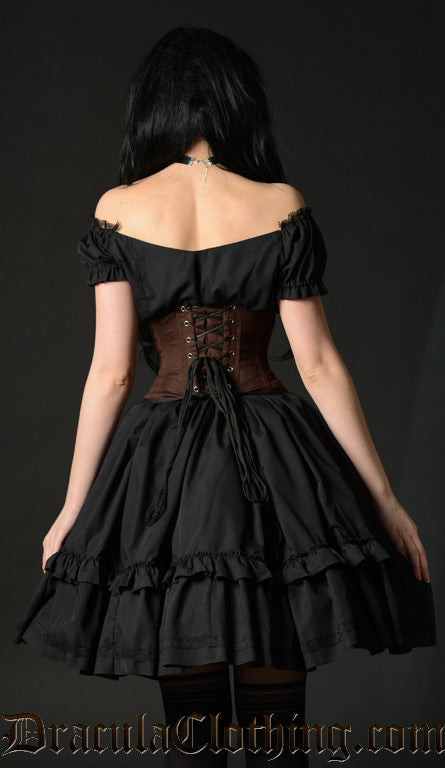Back view of women's black dress worn with waist cincher and sleeves down in an off shoulder style