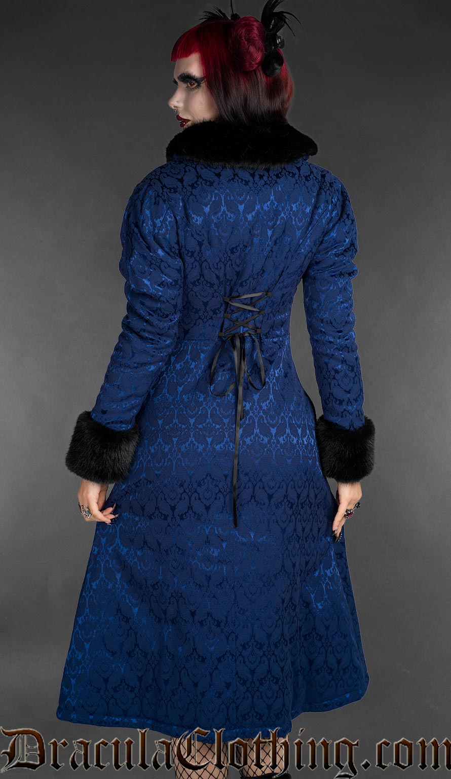 Blue gothic brocade coat with floral pattern, black faux fur collar and cuffs, and lace-up back detail