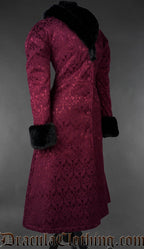 Front angled view of burgundy gothic brocade coat with black faux fur collar and cuffs on a gray background