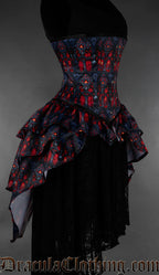 Red and black gothic bustle corset featuring cathedral inspired stained glass print side view