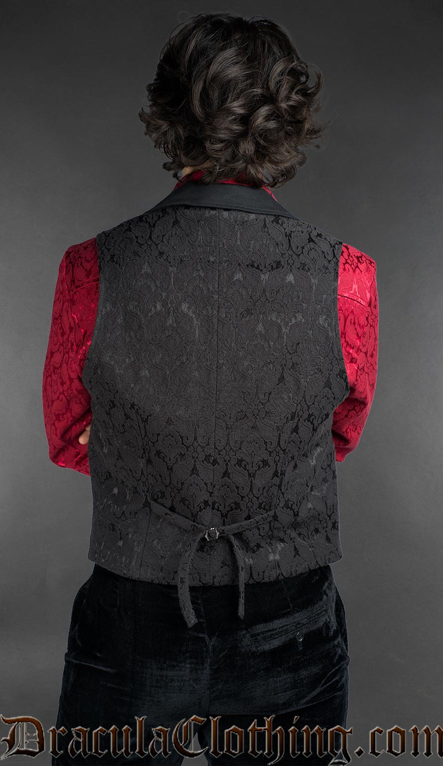 Back view of Gothic double-breasted black cotton brocade waistcoat with peak lapels worn over a red Victorian shirt