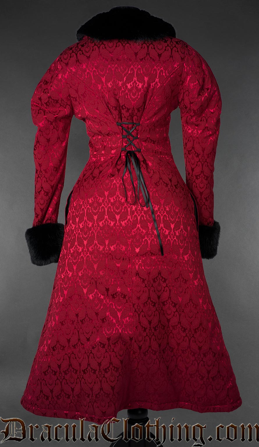 Red gothic brocade coat with black faux fur trim, back view on a gray background
