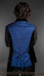 Back view of Men’s blue brocade gothic waistcoat with black shawl lapel, Victorian alternative vest worn over a black shirt