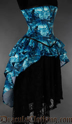 Blue and black gothic bustle corset featuring moonlit graveyard artwork side view