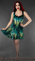 Model wearing a gothic velvet skater dress with black cat and graveyard print