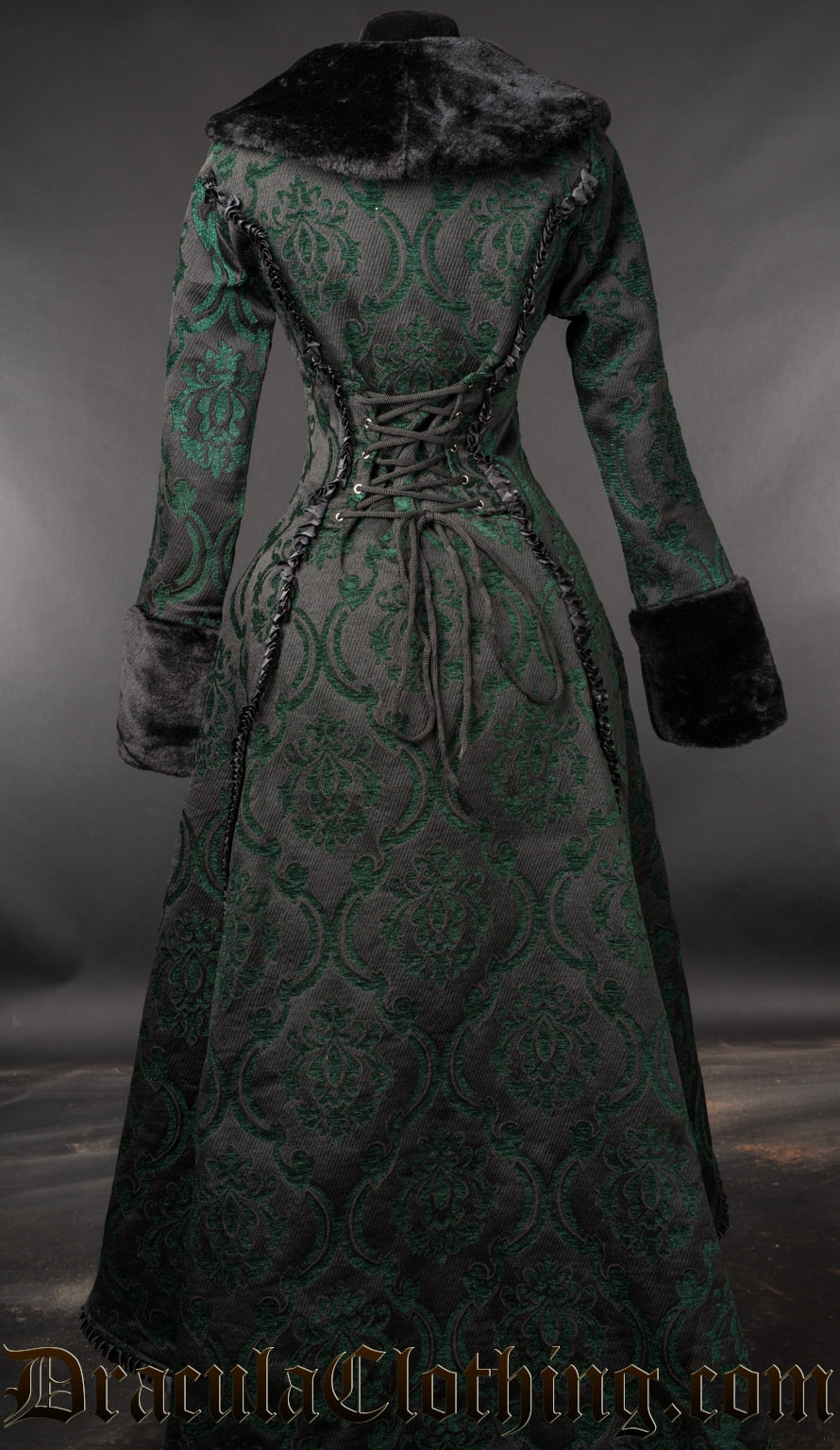 Back view of women's green and black brocade coat showing adjustable lacing in torso
