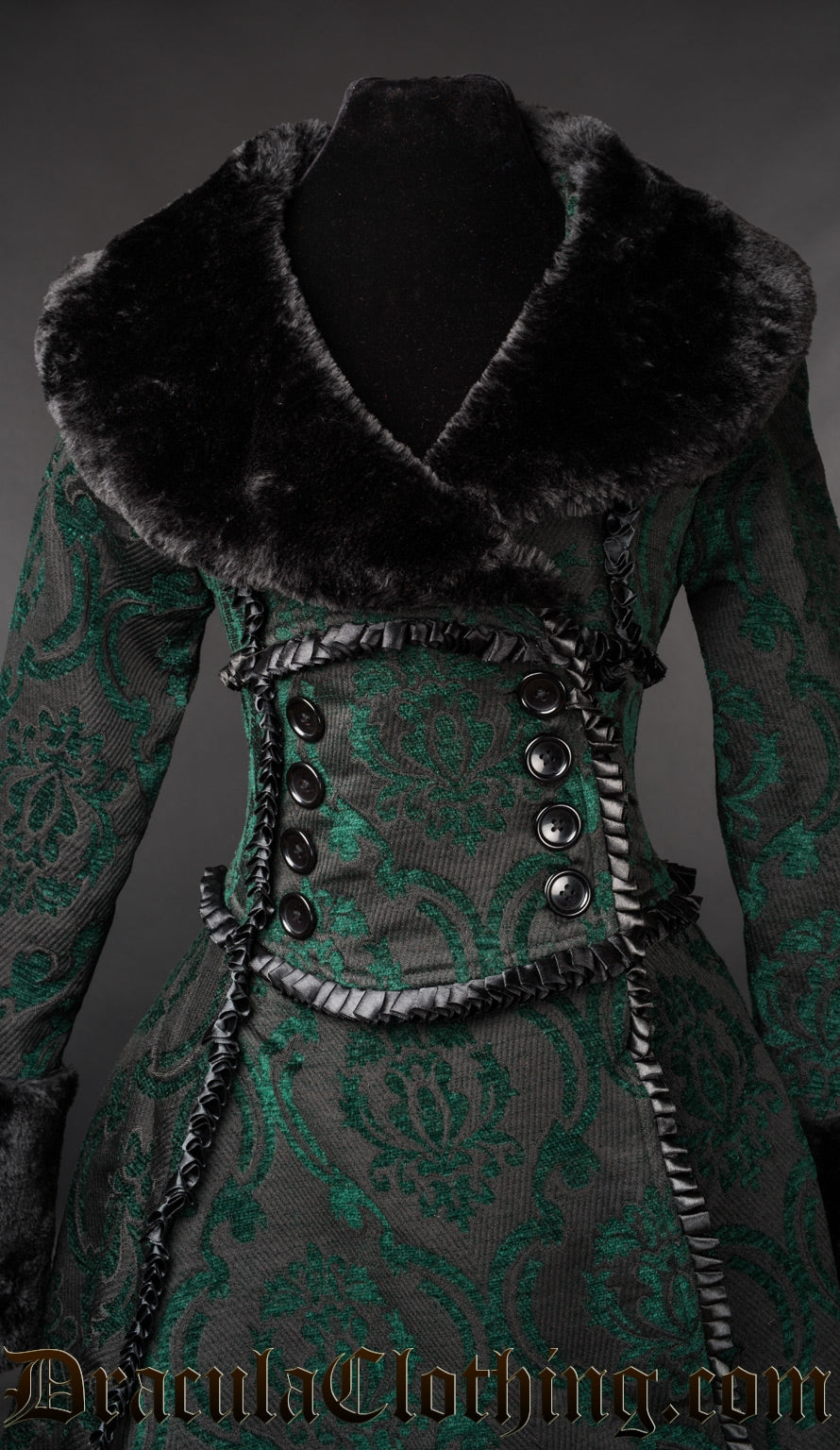 Close up front view of black and green women's winter coat showing faux fur wrap neckline decorative buttons and satin trim details