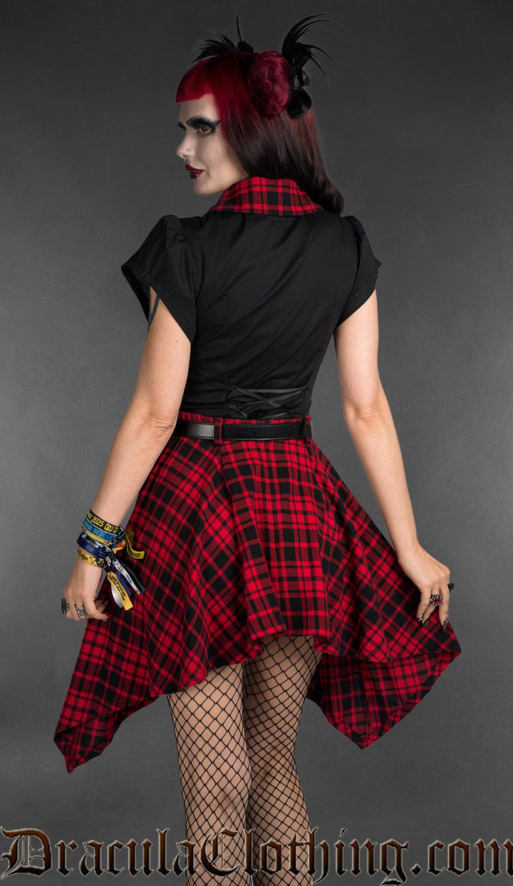 High low cotton tartan skirt with pockets with black blouse with tartan details back view