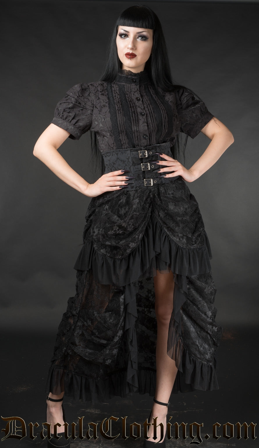 Black high waisted lace bustle skirt with buckle design worn by a model