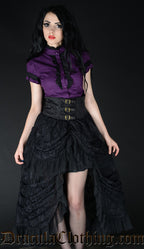 Model wearing high waisted black lace layered bustle skirt with purple blouse