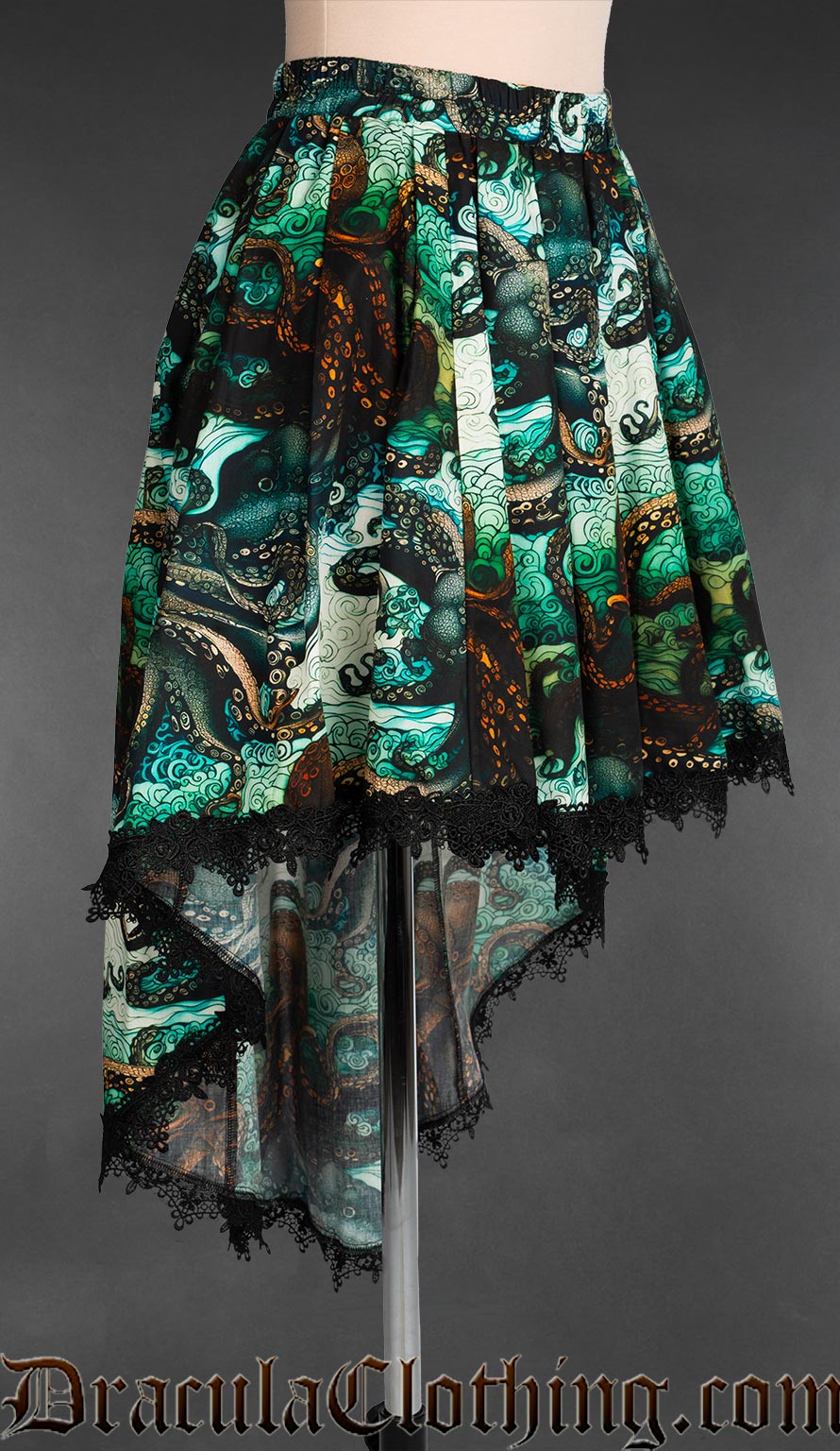 Side view of women's green blue kraken print skirt showing longer length at back of high low style