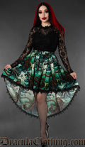 Model wearing kraken print high low skirt with black lace trim hem