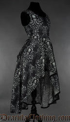 Side view of grey kraken print women's sleeveless dress showing longer skirt in the back and short in the front