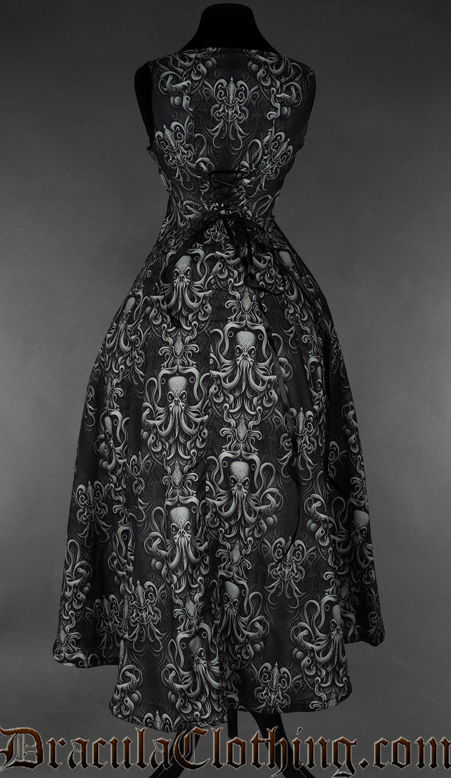 Back view of grey and black women's kraken print dress showing adjustable corset style lacing in the torso