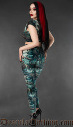 Model wearing gothic velvet leggings with blue kraken and tentacle print back view