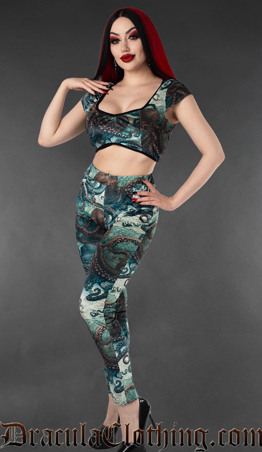 Model wearing gothic velvet leggings with blue kraken and tentacle print
