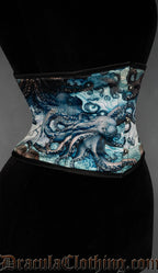 Side view of waist cincher showing blue and green octopus kraken inspired print