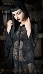 Close up of model showing hood and flared trumpet sleeves of the black lace overdress