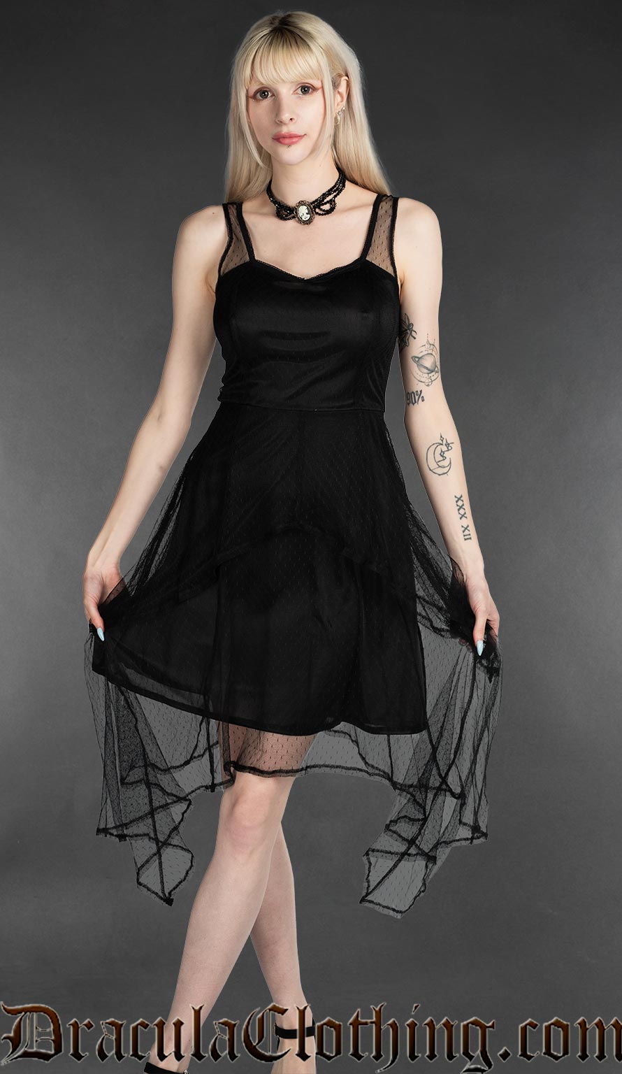 Women's short black dress with sheer lace layers forming a handkerchief style hem