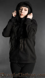 Woman wearing a black gothic zip hoodie with hood up in minimalist dark fashion style