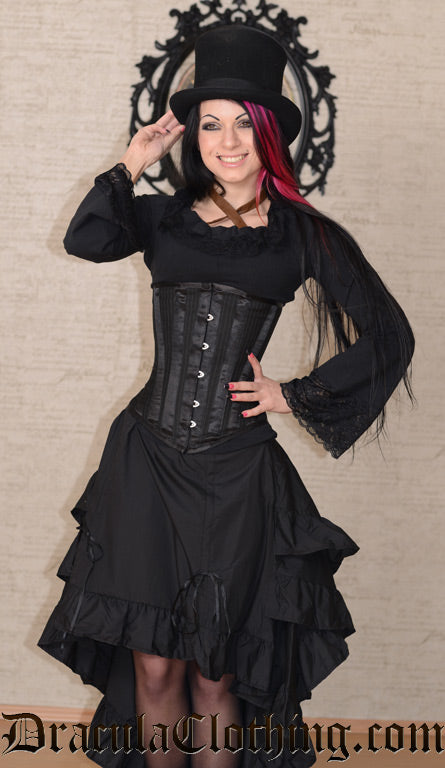 Front view of model wearing black bustle skirt with corset and black blouse