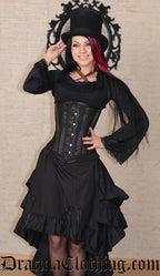 Front view of model wearing black bustle skirt with corset and black blouse