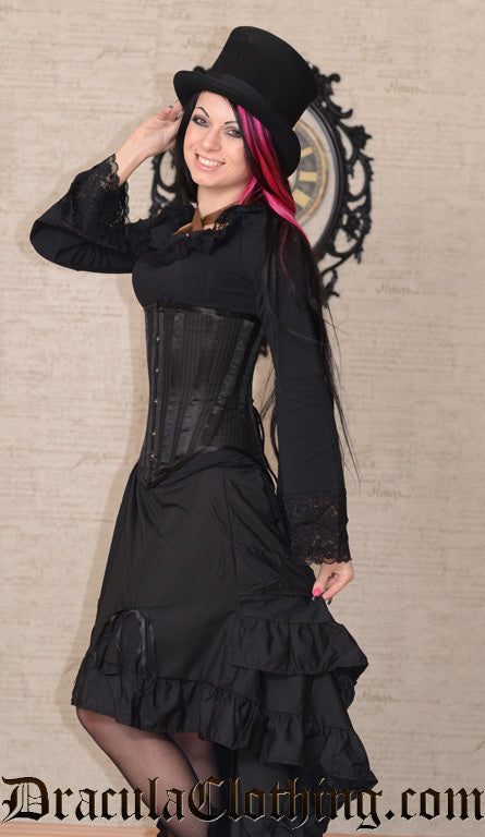 Model wearing women's black layer bustle skirt with black long sleeved blouse and underbust corset