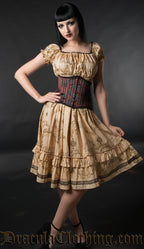 Knee length women's dress with ancient map inspired beige print worn by model with additional waist cincher