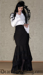 Women's white blouse with long sleeves that are flared at the cuffs and detachable cravat worn by model 