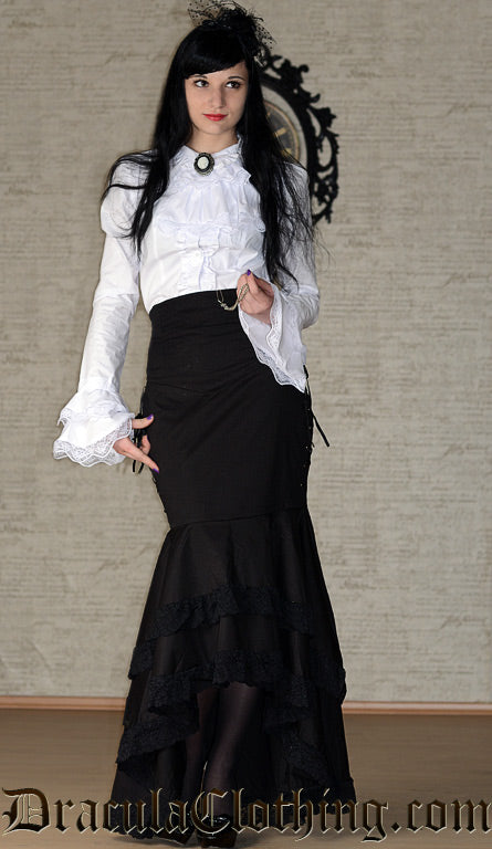 Model wearing women's white long sleeve blouse with cravat and flared layered sleeve cuffs