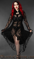 Women's long sleeve sheer lace dress made with black lace in a high low style worn by model