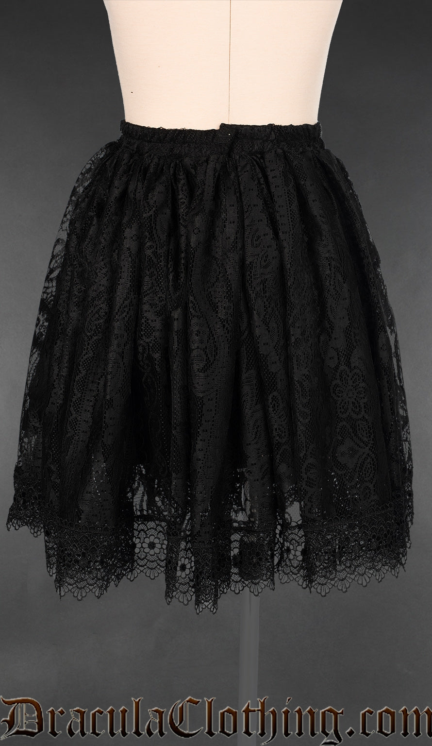 Back view of women's black lace and cotton skirt with elasticated waist