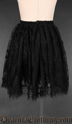 Back view of women's black lace and cotton skirt with elasticated waist