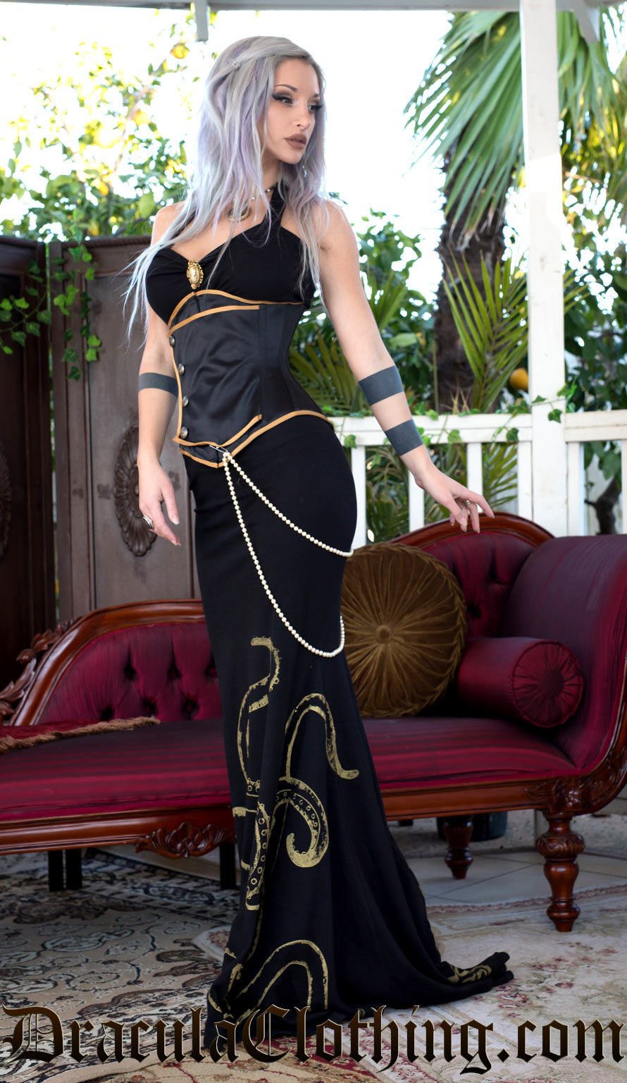 Black ball gown with gold octopus print worn with additional corset and jewellery