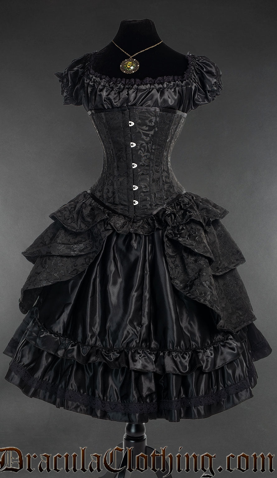 Black brocade bustle corset shown over a black satin dress