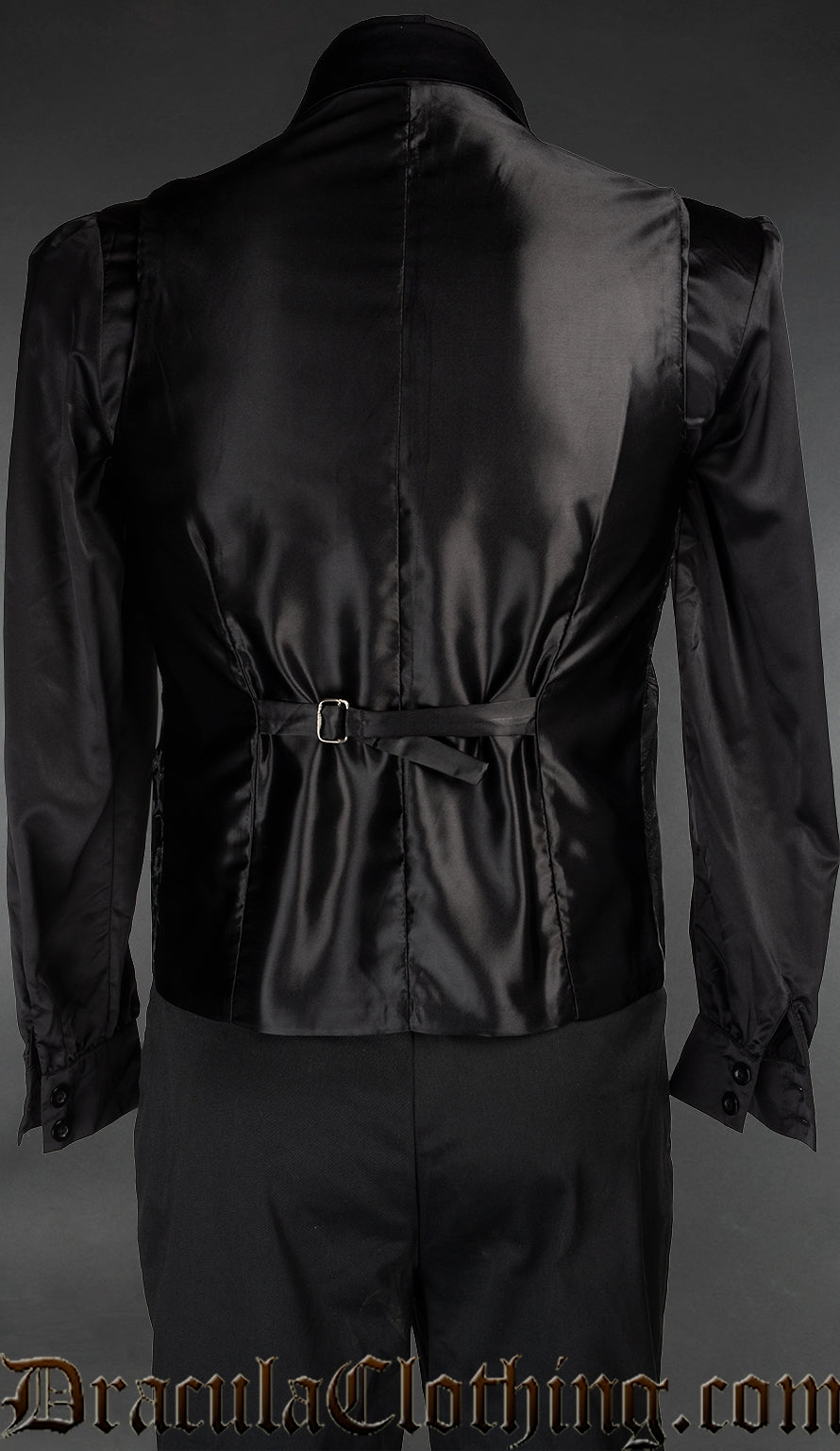 Back view of men's black brocade groom waistcoat vest showing belt for adjustment and satin fabric back