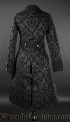 Back view of women's black brocade pirate coat showing decorative buttons on sleeve cuffs and half belt