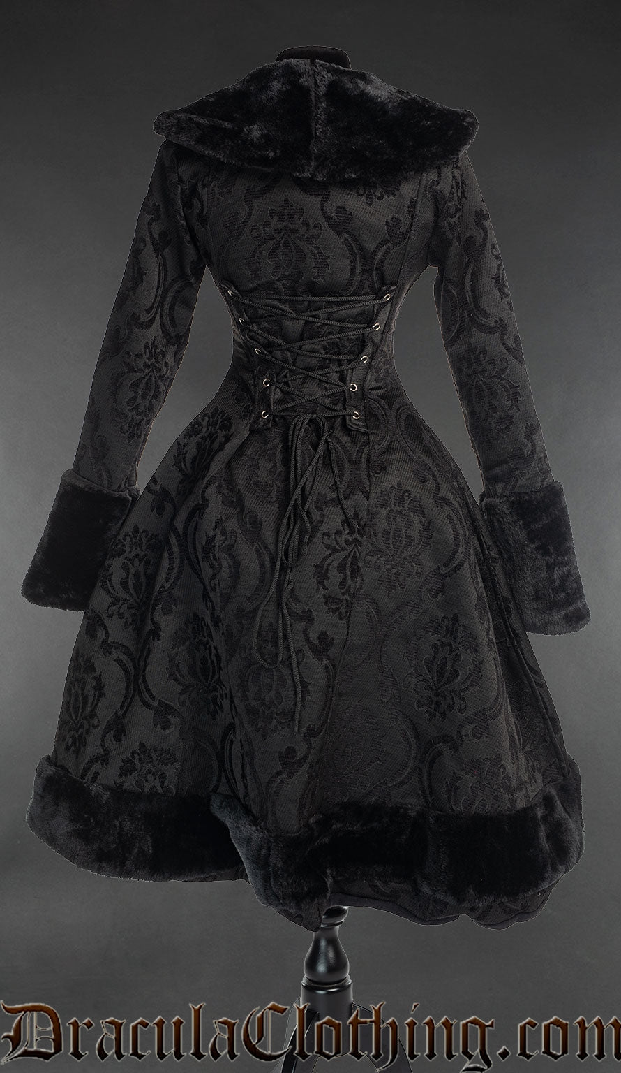 Back view of black brocade women's coat showing longer back and adjustable corset style lacing in the torso