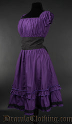 Side view of knee length purple cotton dress with removable black belt showing highly elasticated bust and sleeves