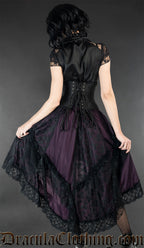 Back view of model wearing purple and black satin ruffle skirt showing lace trim and details